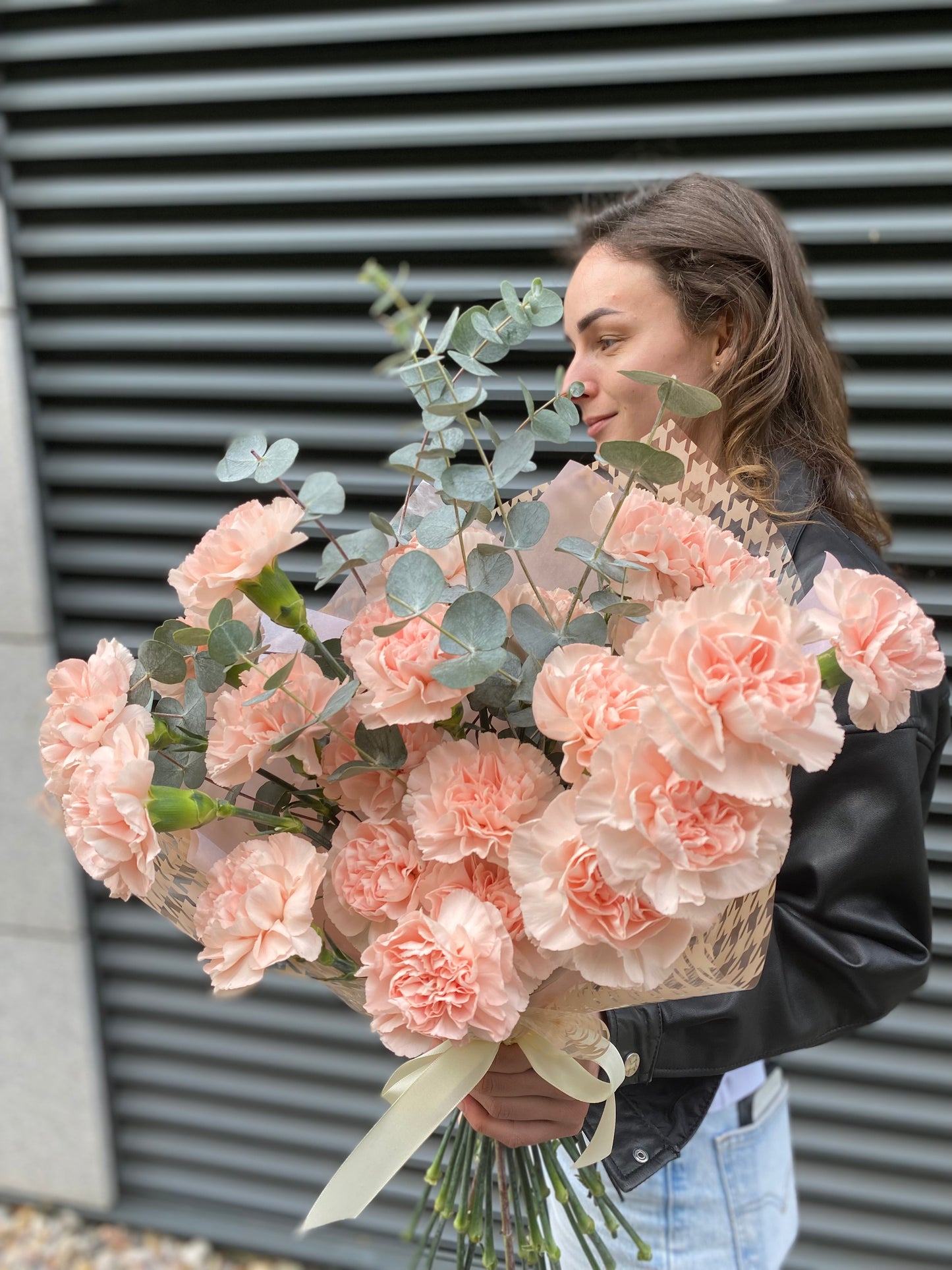 
                  
                    Bouquet of soft carnations with eucalyptus
                  
                