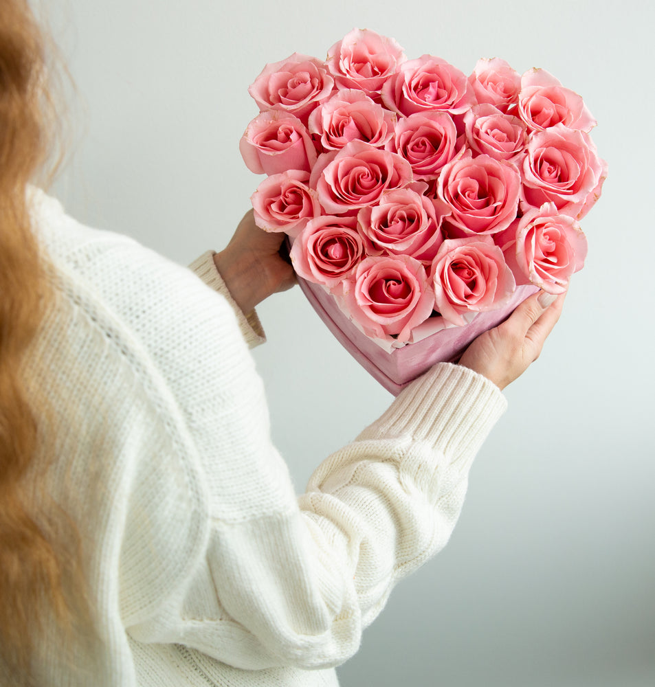 
                  
                    Pink roses in a heart shaped box
                  
                